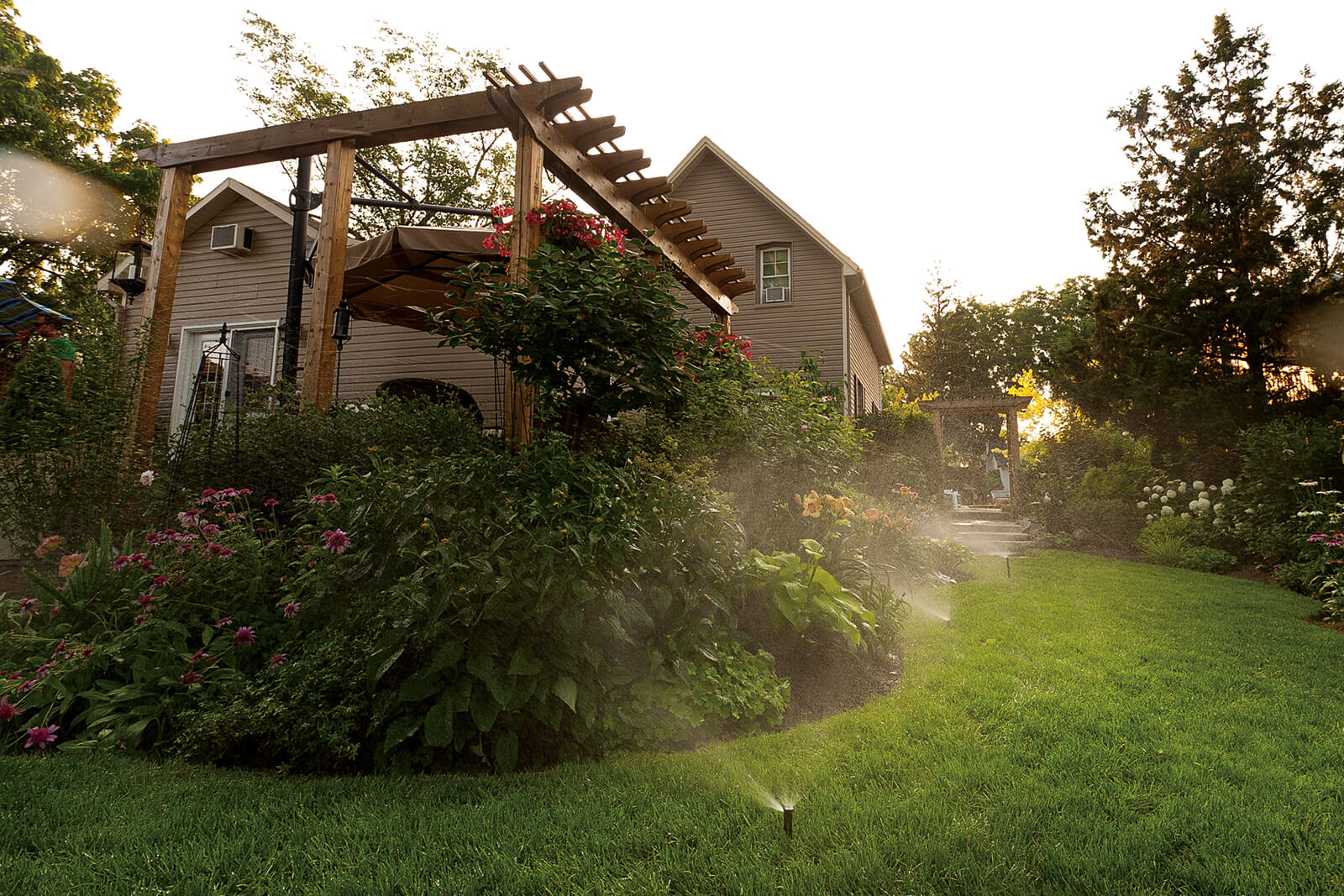 garden and lawn watered with in-ground irrigation system