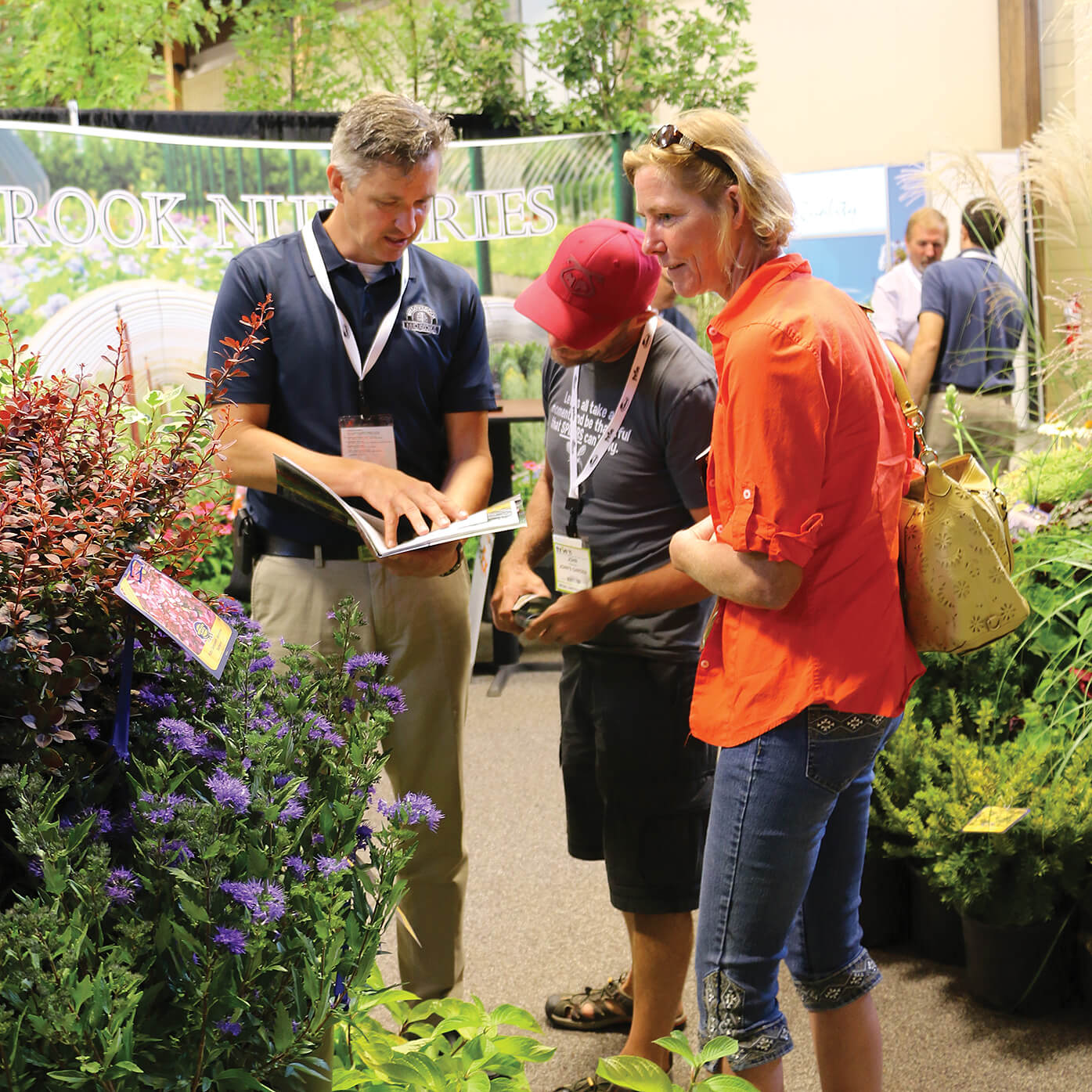 people shopping for plants at a trade show