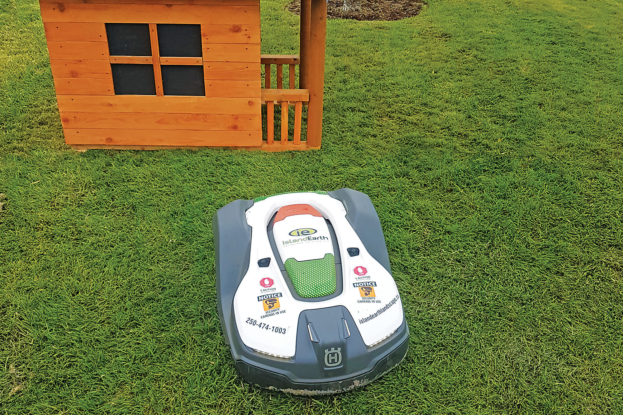 robotic mower in front of an obstacle