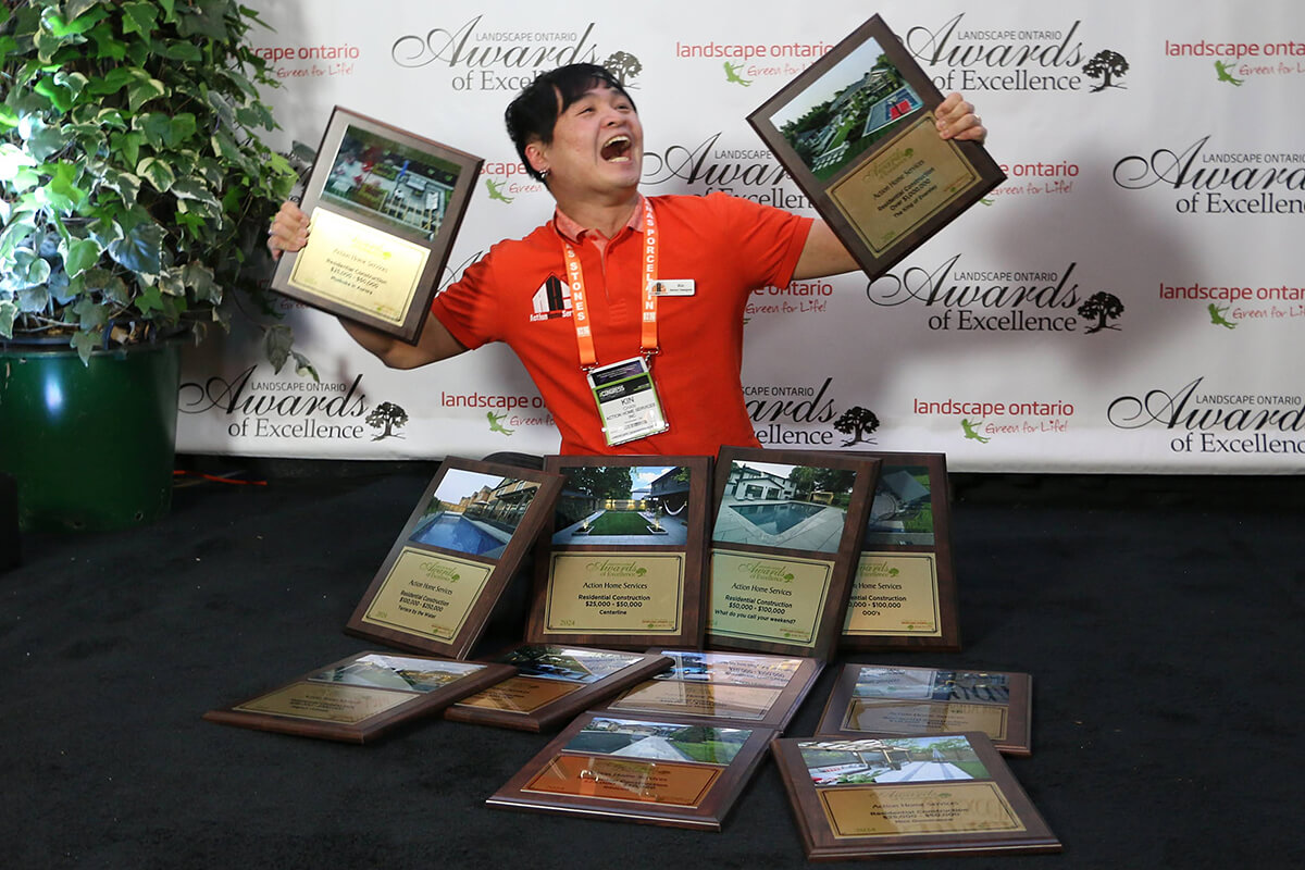 person surrounded by awards