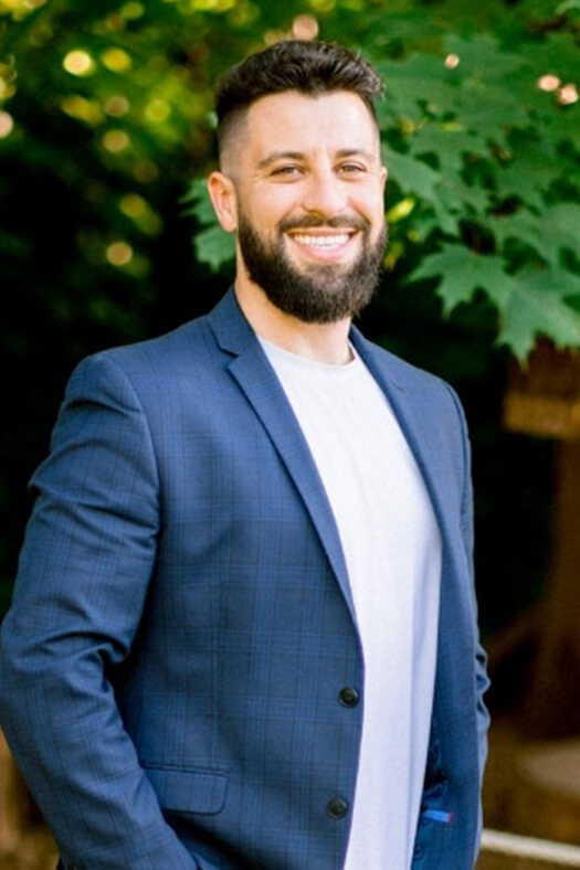 man wearing a blue jacket outside