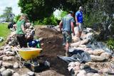 Participants building a pondless waterfall on the LO site in Milton, Ont.