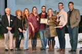 Modern Landscape Designers and Trimatrix Construction receive the Garden of the Year Award on stage at Canada Blooms.