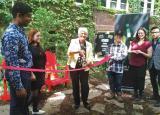 Students accompany Liz Sandals, MPP Guelph at a ribbon cutting ceremony to celebrate the new garden.