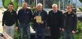 Members of the Vanderkurk family accept a special plaque from LO’s Tony DiGiovanni.