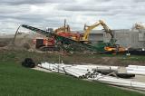 Material from the old bridge is crushed for use on the LO property.