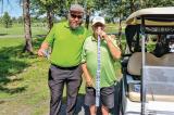 Volunteer Lindsay Ross (left), sells an arms length of raffle tickets to LO’s Denis Flanagan.