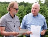 Fred Somerville, left, takes the opportunity to thank MPP Jim Wilson for his work to see the Christmas Tree Day Act pass through the provincial legislature.