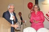 LO executive director Tony DiGiovanni accepts an award from Jane Wilson, Director of Women Services, Community Microskills Development Centre.