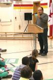 Golden Horseshoe president Fiore Zenone explains to students that each of them will receive a package of tree seeds to take home.