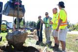 From left, Grant Harrison CLT of Escapes Outdoor Living Designs of London, Chapter past president; Jason Zehr of Rural Roots Landscaping of London, and Mike Martins of Kimmick Landscaping, both Chapter directors, and an unnamed volunteer set a tree.