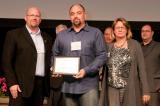 Jeff Olsen, Canada Blooms co-chair, presents the Sheridan Nurseries Award for outstanding garden to Joe Morello of Premier Landscaping, builder, and Judith Wright, landscape architect who designed the Ben Heppner garden.