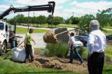 LO Board members, Ryan Health (left) and Gerwin Bouman (right) assist with the tree planting.