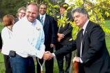 London Chapter president Grant Harrison and London mayor Joe Fontana plant the first tree as part of the Veterans Memorial Parkway project.