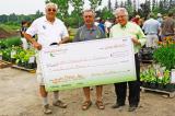 Brian Cocks CLT, centre, announced a pledge of $100,000 towards the OHTF endowment fund. He was joined in the giant cheque presentation by Foundation president John Wright, left, and LO executive director Tony DiGiovanni CHT.