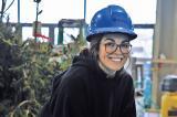 A Humber College student sets a stone at her school’s Congress garden build; a foundation for her future career.