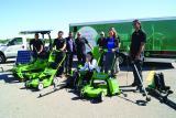 The team from International Landscaping proudly displaying solar and electric grounds maintenance equipment.