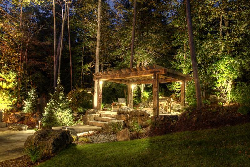 2013 - Landscape Lighting Design & Installation - Over $30,000 - Another angle of pergola. Spruce just past bridge is lit from both angles due to focal location