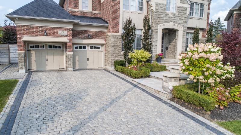 2017 - Residential Construction  - $100,000 - $250,000 - Shot of driveway, front entrance and planting.