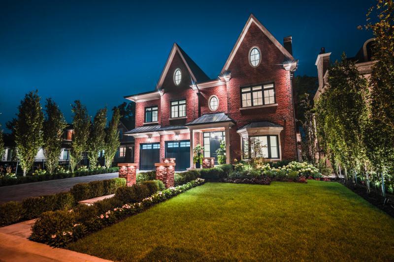 2018 - Landscape Lighting Design & Installation - Over $30,000 - Night photo of front walkway, pillars, and plantings