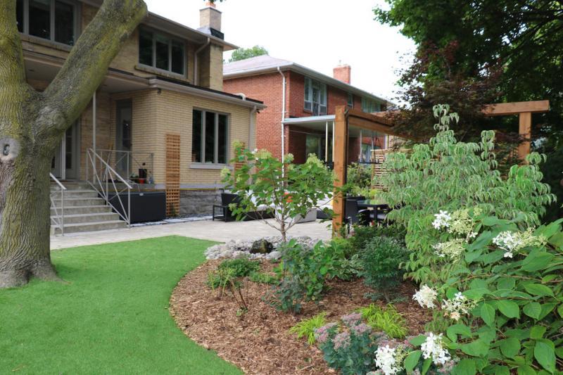 2021 - Residential Construction - $25,000 - $50,000 - Artificial turf meets mulch of partial shade garden