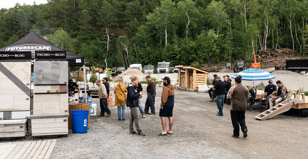 People talking in a landscape supply yard