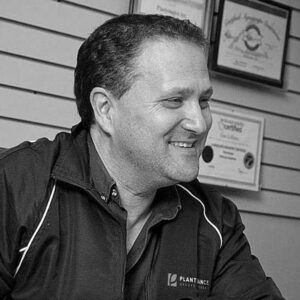 Black and white image of a man with short hair